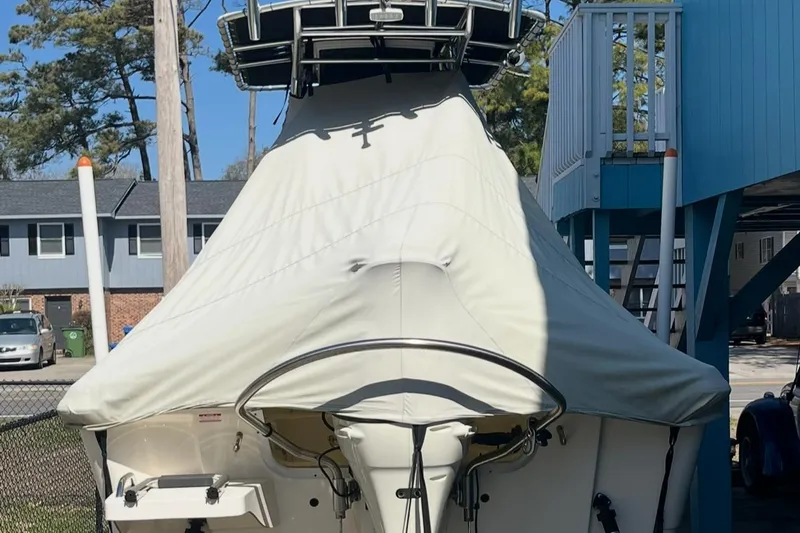 Slide: The Image of Covered 2020 Bulls Bay 2000 boat parked outdoors near residential area. - 4