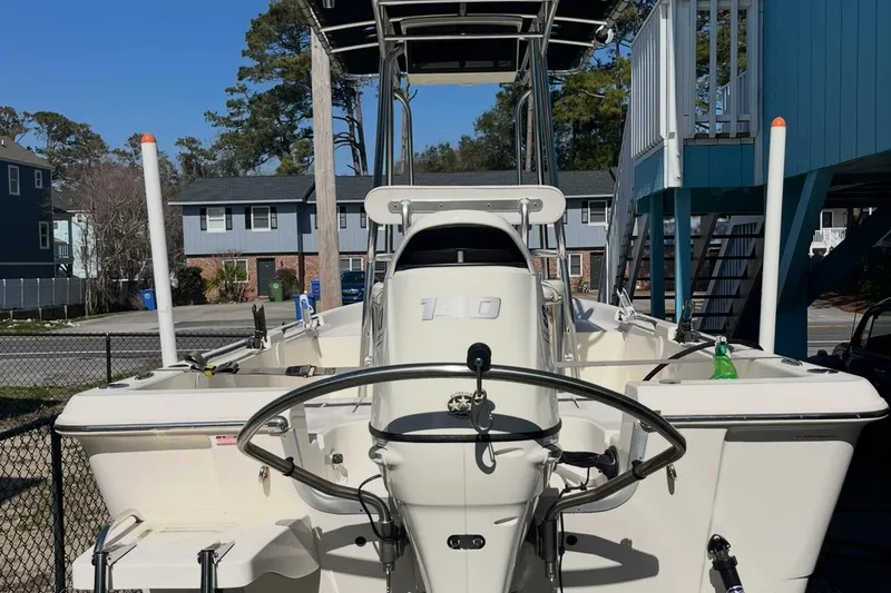 Slide: The Image of 2020 Bulls Bay 2000 boat with T-top, parked in residential area. - 5