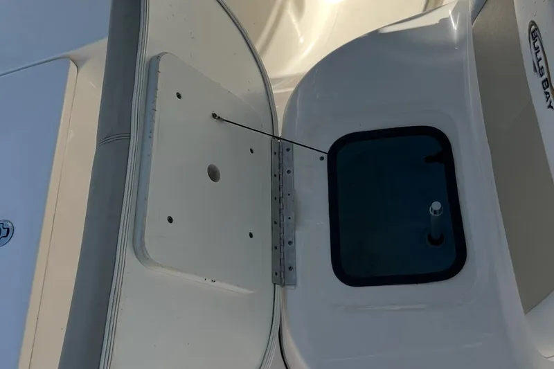 Slide: The Image of Bulls Bay 2000 boat interior detail, 2020 model, featuring storage compartment and hatch. - 7