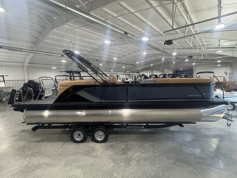 The Image of 2025 Godfrey Sweetwater 2286 SB pontoon boat in showroom, featuring 27" iMPACT Center Tube Package. - 1
