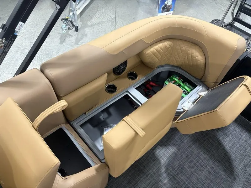 Slide: The Image of Interior of 2025 Godfrey Sweetwater 2286 SB boat with tan seating and storage compartments. - 23