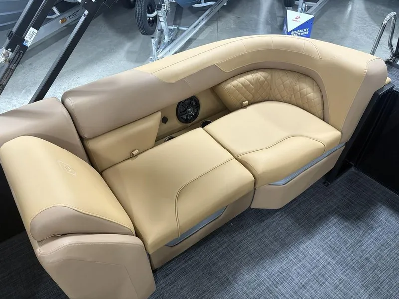 Slide: The Image of Luxurious tan seating on 2025 Godfrey Sweetwater 2286 SB pontoon boat, featuring quilted accents. - 24