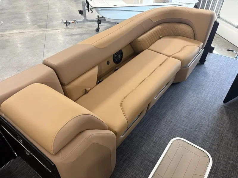 Slide: The Image of Luxurious tan seating on 2025 Godfrey Sweetwater 2286 SB pontoon boat, featuring elegant design and comfort. - 7