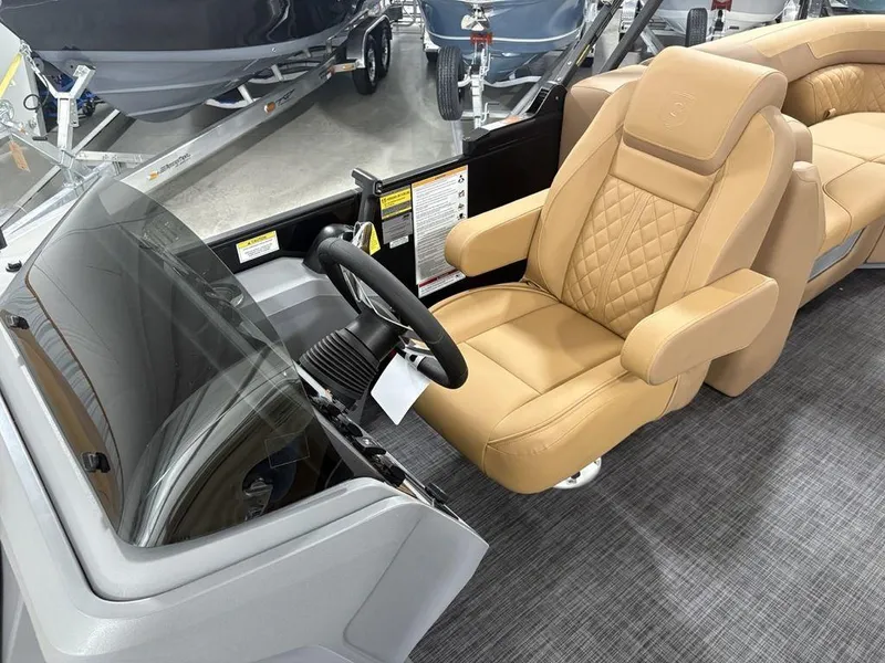 Slide: The Image of Luxurious interior of 2025 Godfrey Sweetwater 2286 SB pontoon boat with tan leather seating. - 9