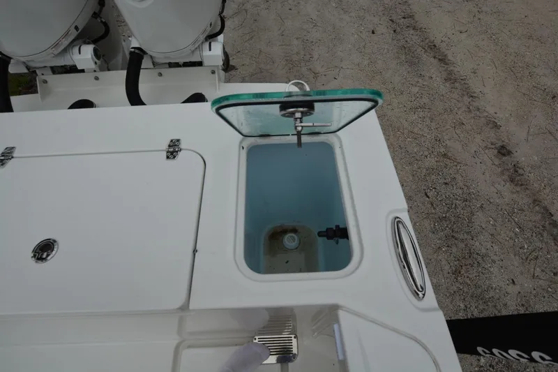 Slide: The Image of Open hatch on Parker 2420 boat, showcasing storage compartment, 2025 model. - 22