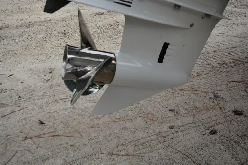 Slide: The Image of Close-up of a Parker 2420 boat propeller, 2025 model, on sandy ground. - 24