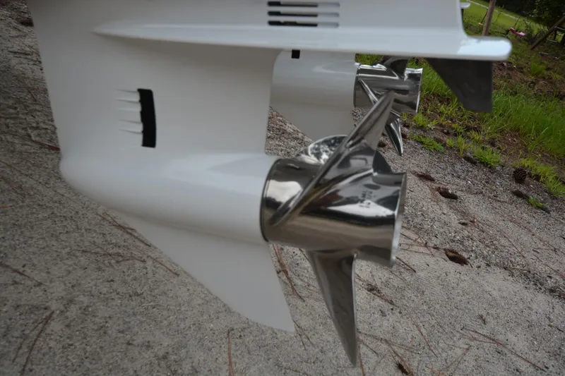 Slide: The Image of Close-up of Parker 2420 boat propellers, 2025 model, on a sandy surface. - 25