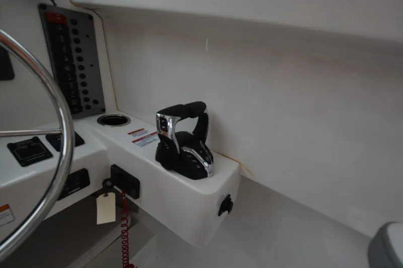 Slide: The Image of Control panel and throttle of 2025 Parker 2420 boat cockpit. - 8