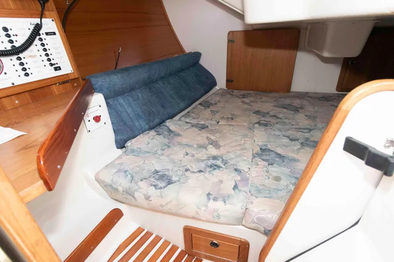 Slide: The Image of Cozy cabin interior of a 2003 Catalina 310 sailboat with a comfortable bed. - 14