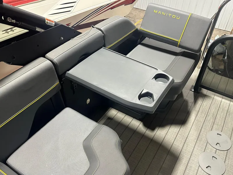 Slide: The Image of 2023 Manitou Explore 24 Navigator with trifold bench and integrated cup holders. - 16