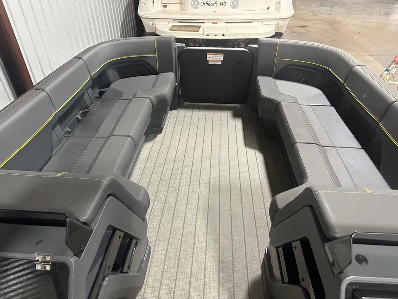 Slide: The Image of 2023 Manitou Explore 24 Navigator with Trifold Bench, featuring spacious seating and modern design. - 20