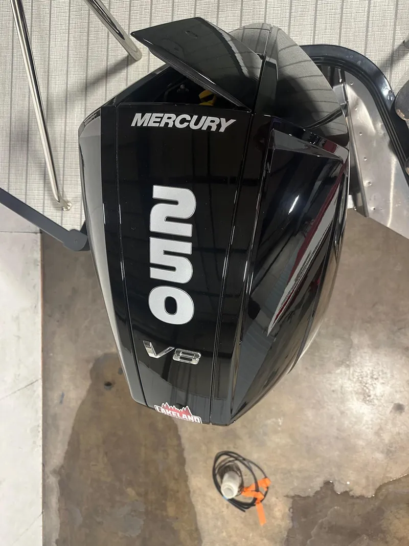 Slide: The Image of Mercury 250 V8 engine on 2023 Manitou Explore 24 Navigator boat. - 21