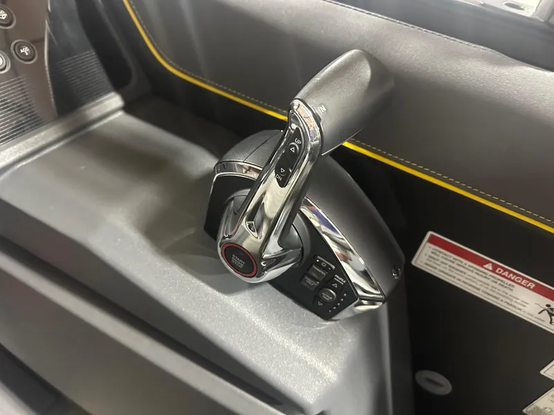 Slide: The Image of Close-up of 2023 Manitou Explore 24 Navigator throttle control with trifold bench. - 9