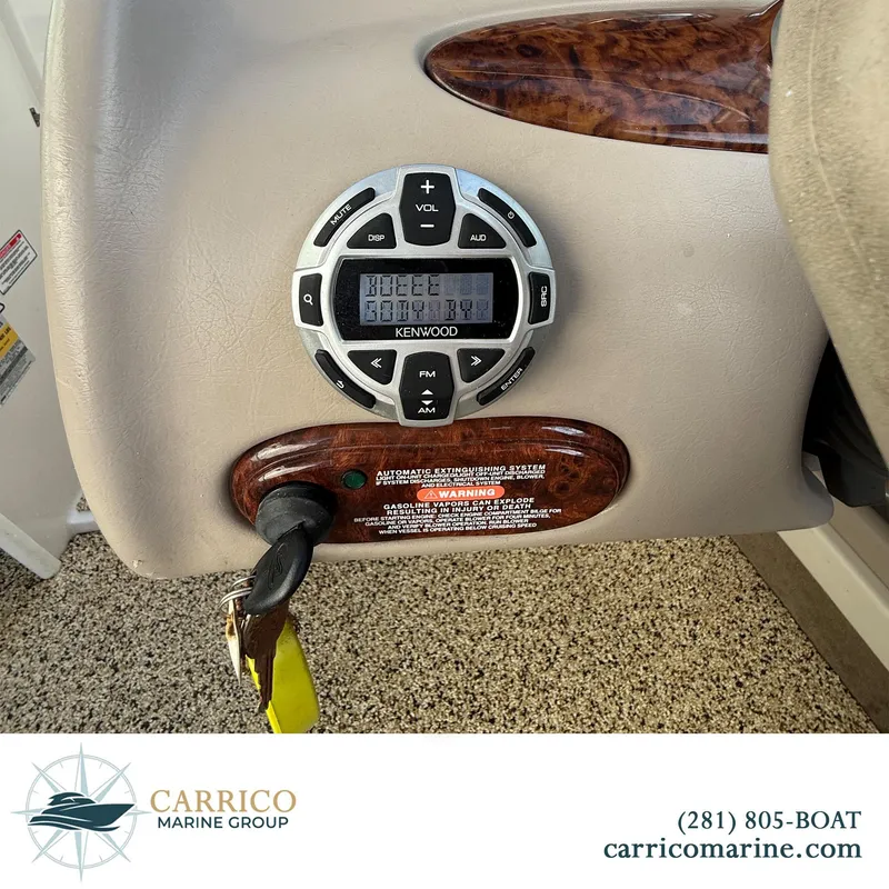 Slide: The Image of Kenwood stereo system on 2003 Sea Ray 220 Bow Rider boat dashboard. - 18