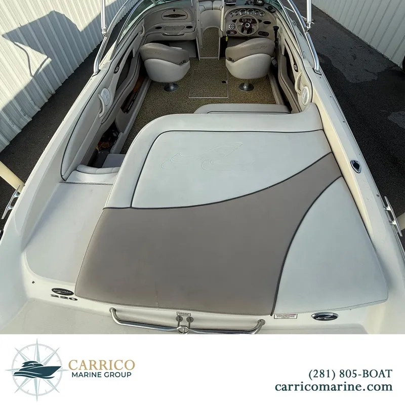 Slide: The Image of 2003 Sea Ray 220 Bow Rider interior with seating and dashboard, Carrico Marine Group. - 6