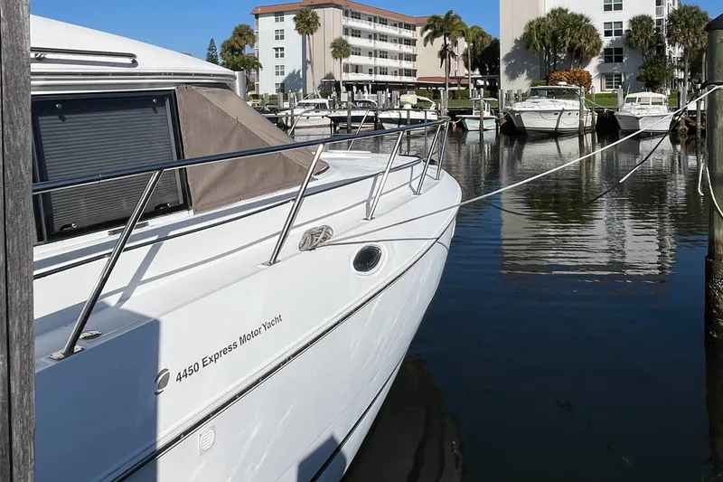 Slide: The Image of 2000 Cruisers Yachts 4450 Motor Yacht docked in a marina. - 11