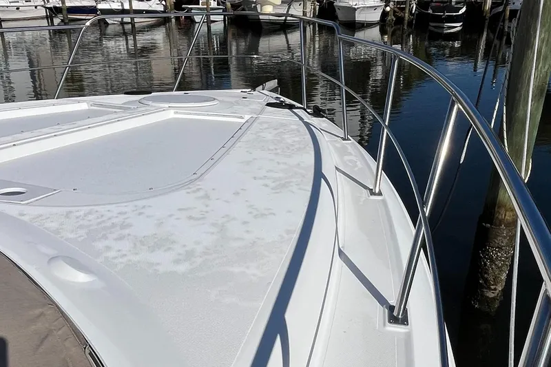 Slide: The Image of 2000 Cruisers Yachts 4450 Motor Yacht deck view at marina. - 19