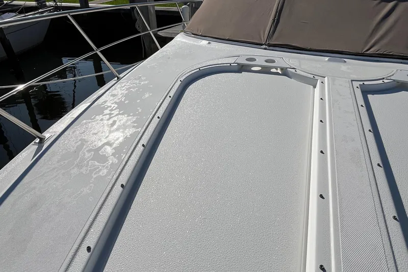 Slide: The Image of 2000 Cruisers Yachts 4450 Motor Yacht deck with sunlight reflections. - 24