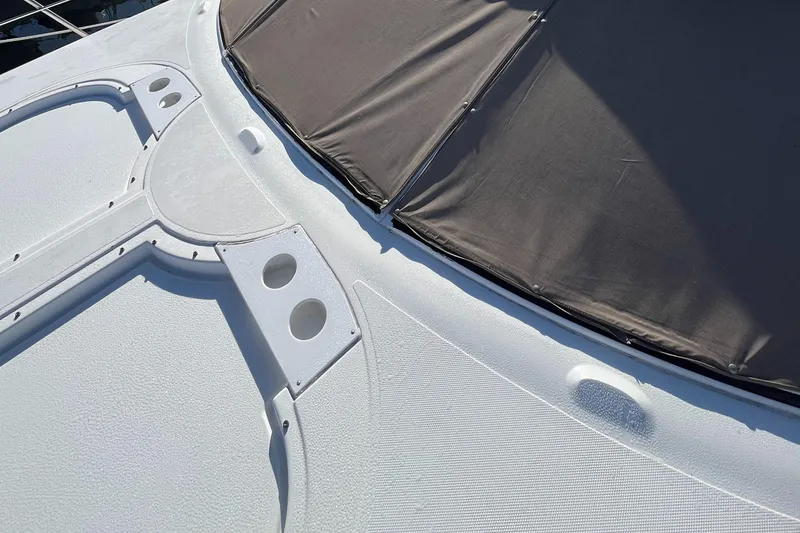 Slide: The Image of 2000 Cruisers Yachts 4450 Motor Yacht deck with sunshade and cup holders. - 31