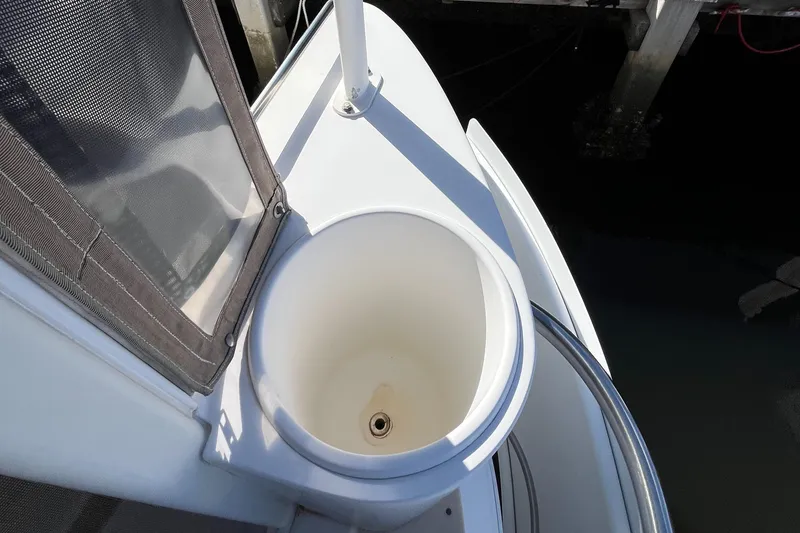 Slide: The Image of 2000 Cruisers Yachts 4450 Motor Yacht deck detail with circular compartment. - 40