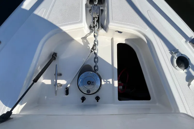 Slide: The Image of Bow anchor system on 2000 Cruisers Yachts 4450 Motor Yacht, featuring chain and winch. - 27
