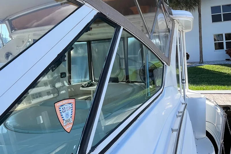 Slide: The Image of 2000 Cruisers Yachts 4450 Motor Yacht with safety check sticker on window. - 35