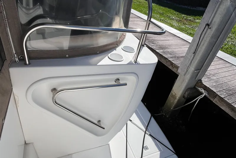 Slide: The Image of 2000 Cruisers Yachts 4450 Motor Yacht deck with stainless steel railing and cup holders. - 42