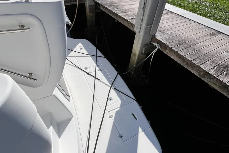 Slide: The Image of 2000 Cruisers Yachts 4450 Motor Yacht docked, showing deck and mooring lines. - 44