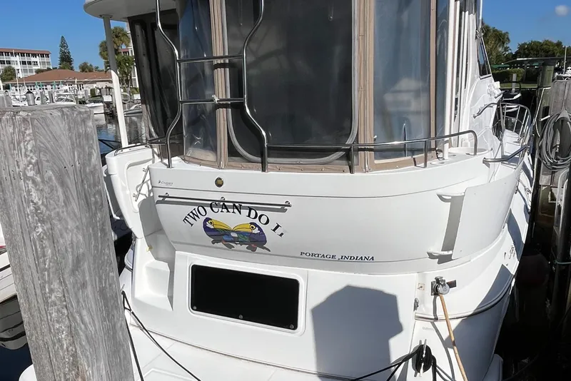 Slide: The Image of 2000 Cruisers Yachts 4450 Motor Yacht docked, featuring "Two Can Do It" nameplate. - 5