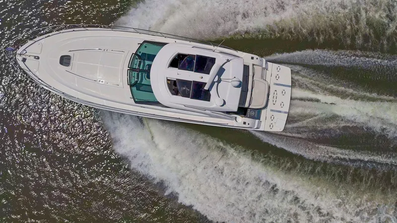 Slide: The Image of Aerial view of 2009 Sea Ray 43 Sundancer yacht cruising on water. - 10