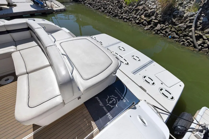 Slide: The Image of 2009 Sea Ray 43 Sundancer boat with spacious seating and swim platform. - 23