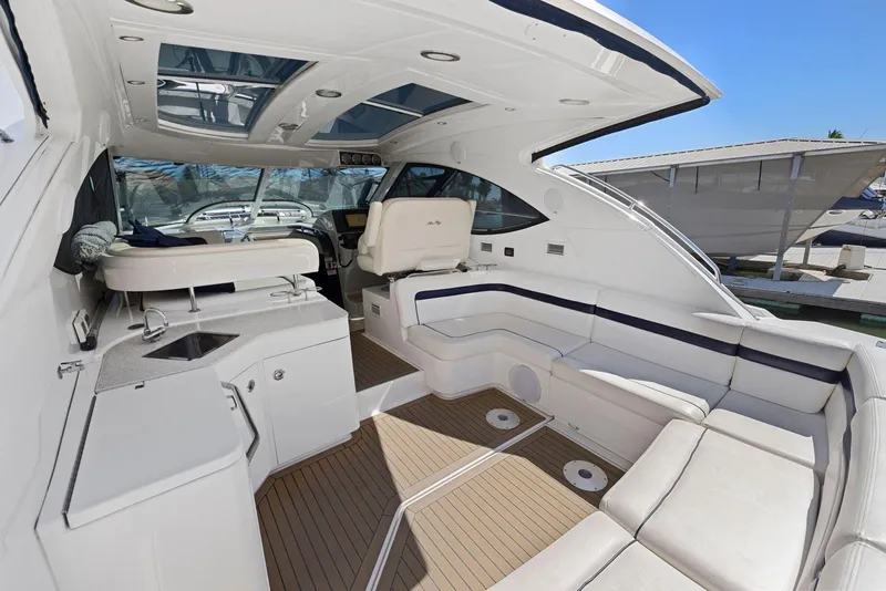 Slide: The Image of 2009 Sea Ray 43 Sundancer yacht interior with spacious seating and modern amenities. - 26
