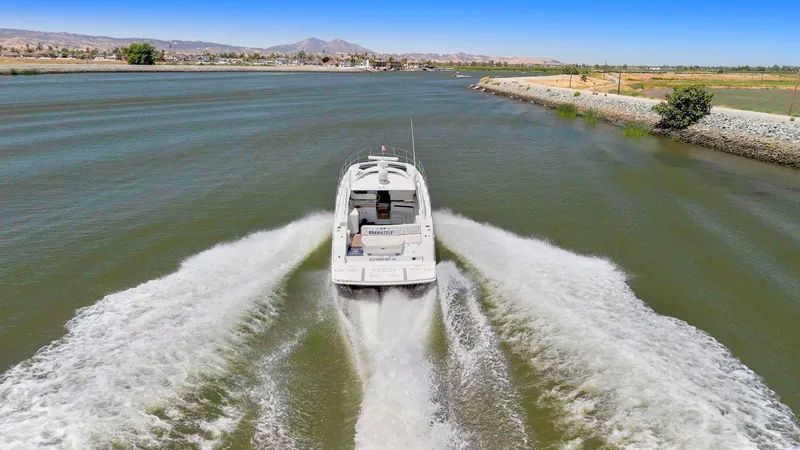 Slide: The Image of 2009 Sea Ray 43 Sundancer cruising on a scenic waterway. - 4