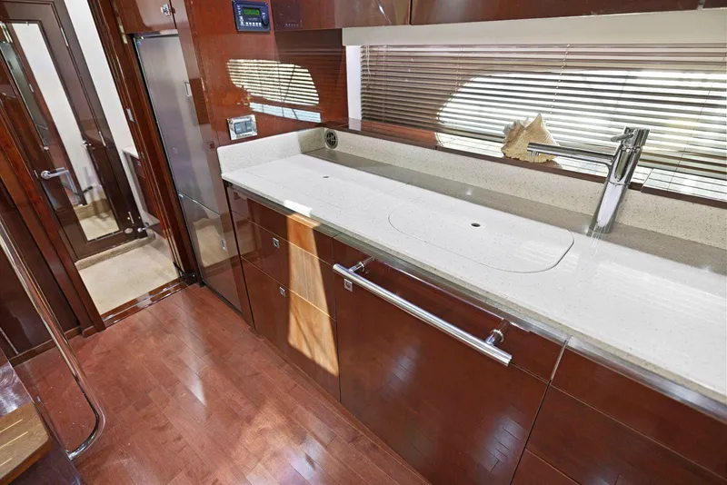 Slide: The Image of Luxurious kitchen area in 2009 Sea Ray 43 Sundancer yacht with sleek cabinetry and modern fixtures. - 49