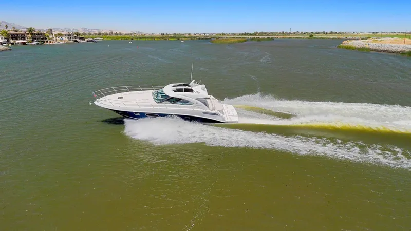 Slide: The Image of 2009 Sea Ray 43 Sundancer cruising on a sunny day in open waters. - 6