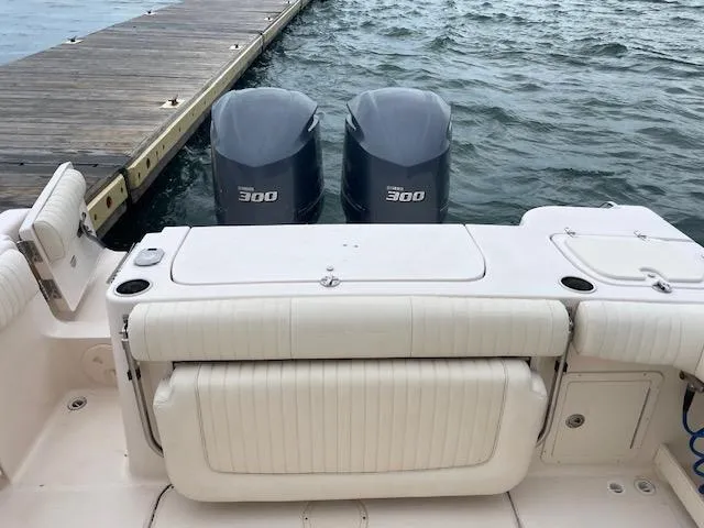 Slide: The Image of 2012 Grady-White 271 Canyon boat with twin 300 horsepower engines at dock. - 11