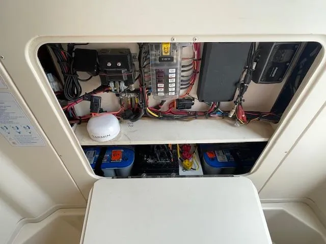 Slide: The Image of Electrical panel of 2012 Grady-White 271 Canyon boat with wiring and components. - 14