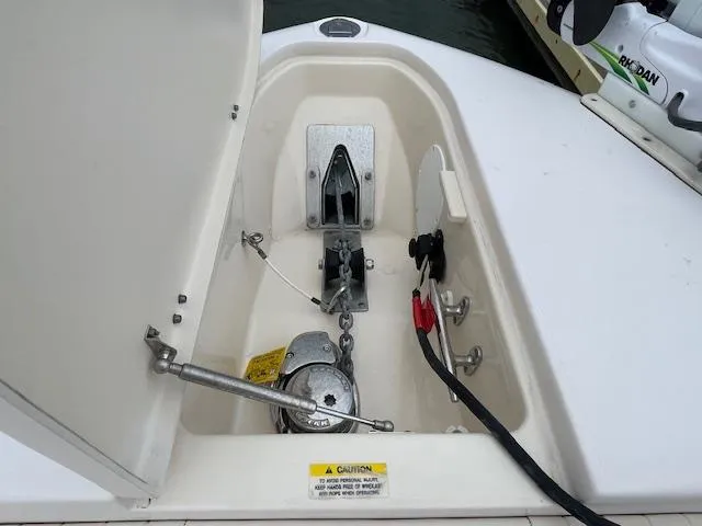 Slide: The Image of Anchor compartment of 2012 Grady-White 271 Canyon boat, featuring anchor and chain storage. - 17