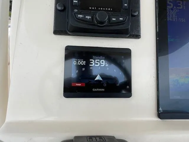 Slide: The Image of Garmin navigation display on 2012 Grady-White 271 Canyon boat dashboard. - 23