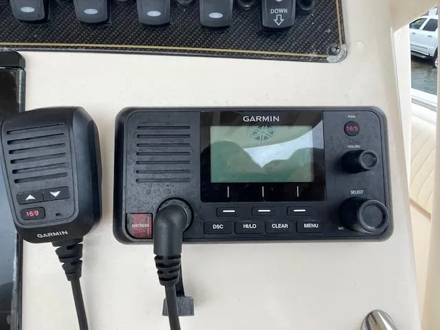 Slide: The Image of Garmin marine radio on 2012 Grady-White 271 Canyon boat dashboard. - 25