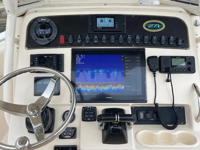 Slide: The Image of Control panel of 2012 Grady-White 271 Canyon boat with navigation and communication equipment. - 28