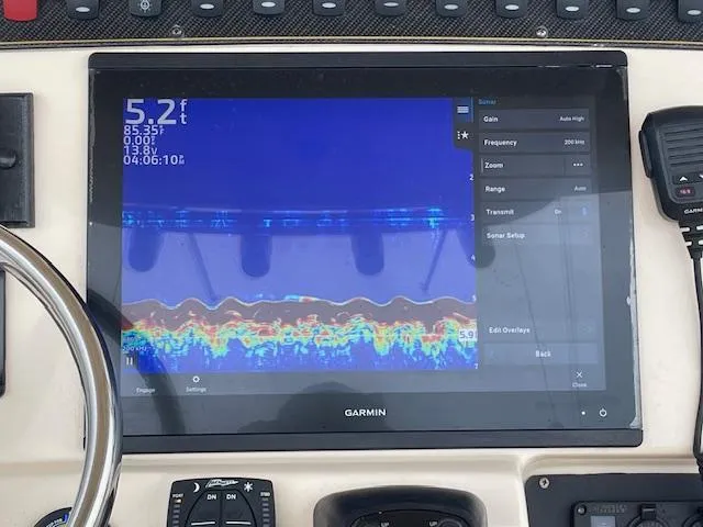 Slide: The Image of Garmin fishfinder display on 2012 Grady-White 271 Canyon boat, showing depth and sonar data. - 29