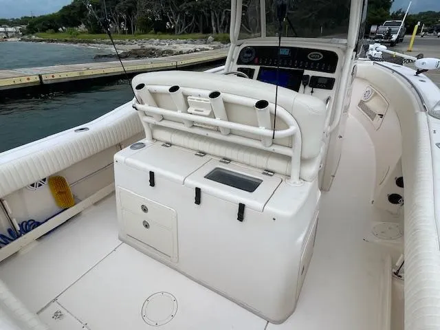 Slide: The Image of 2012 Grady-White 271 Canyon boat interior with fishing rod holders and control panel. - 34