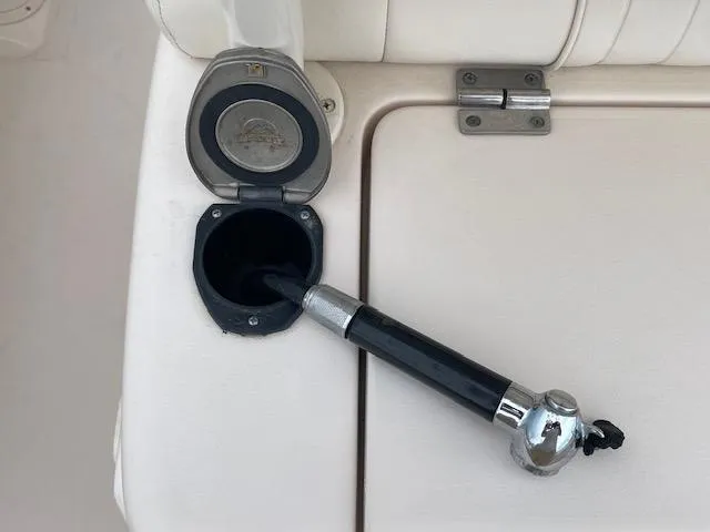 Slide: The Image of 2012 Grady-White 271 Canyon boat detail with fishing rod holder and storage compartment. - 40