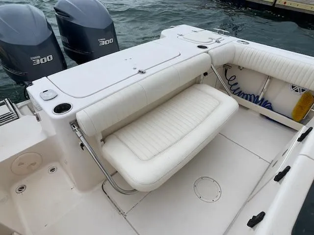 Slide: The Image of 2012 Grady-White 271 Canyon boat with twin Yamaha 300 engines, featuring a spacious seating area. - 41