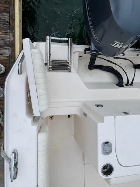 Slide: The Image of 2012 Grady-White 271 Canyon boat with Yamaha engine and swim ladder. - 43