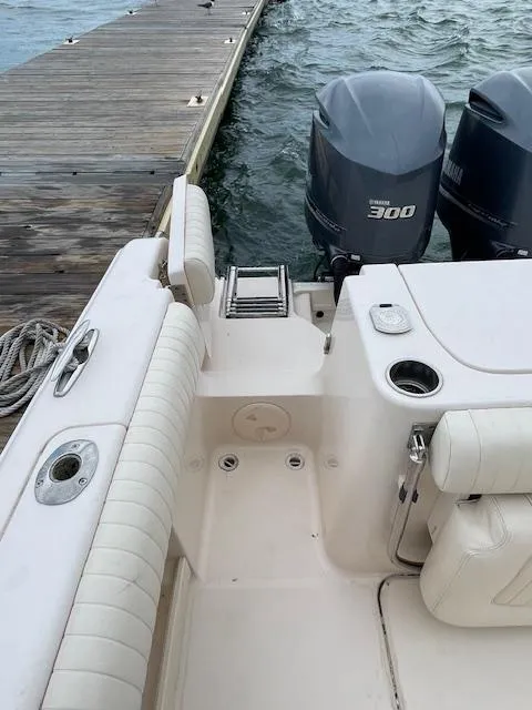 Slide: The Image of 2012 Grady-White 271 Canyon boat with twin Yamaha 300 engines at dock. - 44