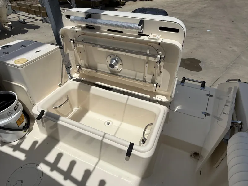 Slide: The Image of Open storage compartment on a 2007 Pursuit 235 Denali LS boat, showing interior details. - 15