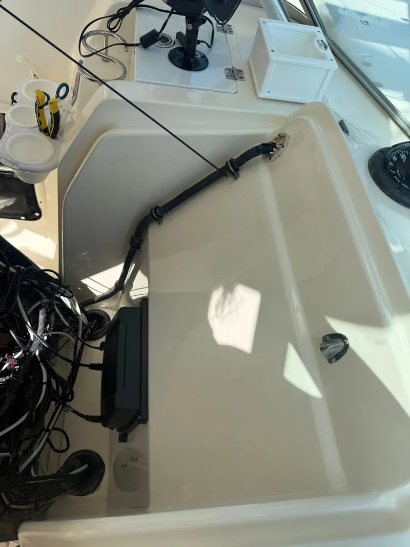 Slide: The Image of 2007 Pursuit 235 Denali LS boat dashboard with wiring and equipment. - 31