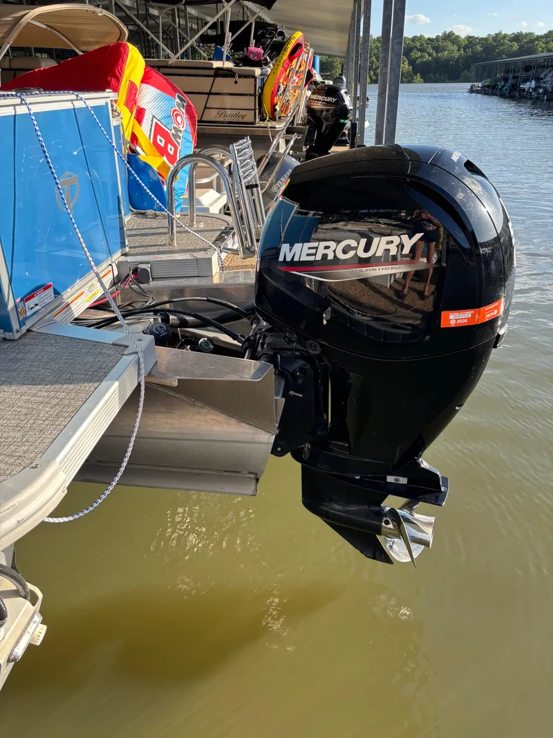 Slide: The Image of 2022 Tahoe Pontoon GT 2585 RF with Mercury outboard motor docked by the lake. - 11